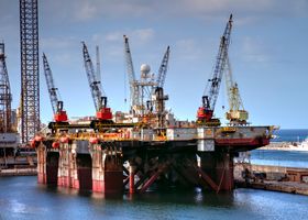 Offshore oil platform with cranes in Palermo harbor, capturing industrial and marine infrastructure.
