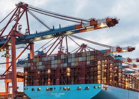 A cargo ship loaded with containers at Hamburg's bustling commercial dock.
